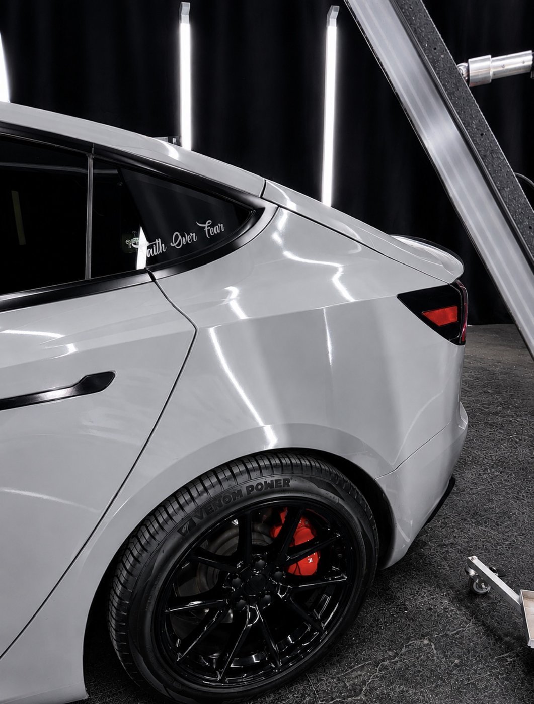 Panel detail work on a customer's Tesla — door dings and creases