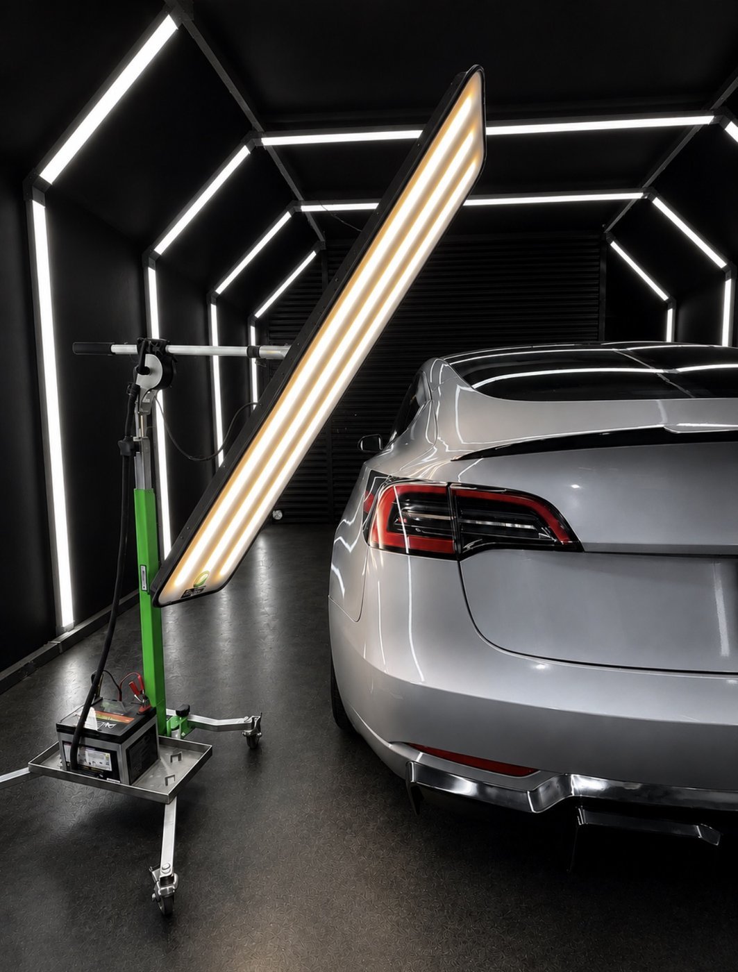 LED reflection board revealing dead-straight panel lines during paintless dent repair